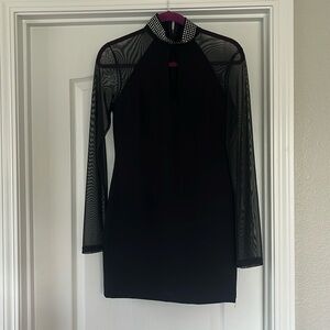 Women’s black sheer long sleeve minidress. New with tags. High beaded collar.